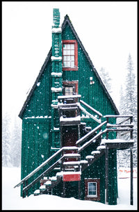 Charming Winter Cabin in Snowy Forest Scene