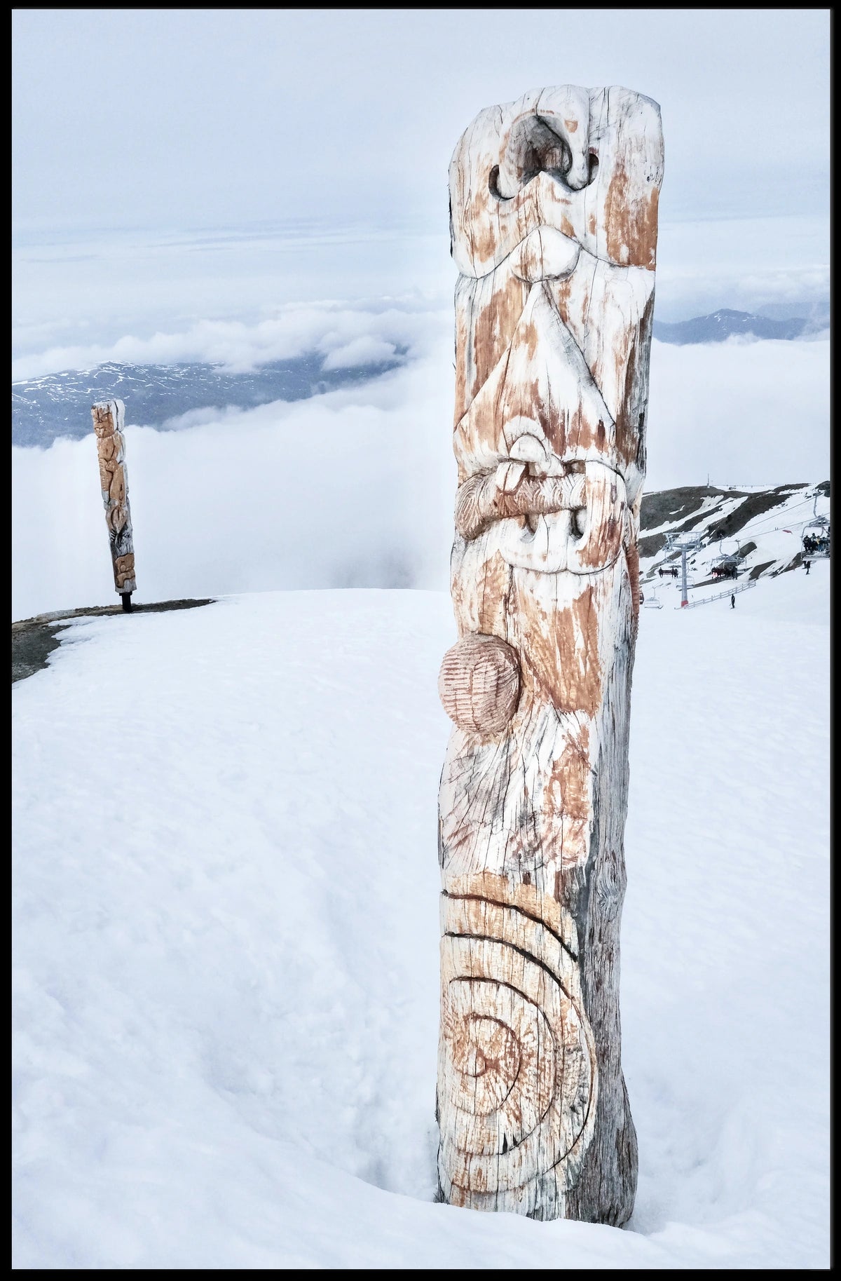 Snow-Covered Totem Poles Poster