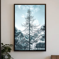 Majestic Winter Tree Against Mountain Landscape Poster