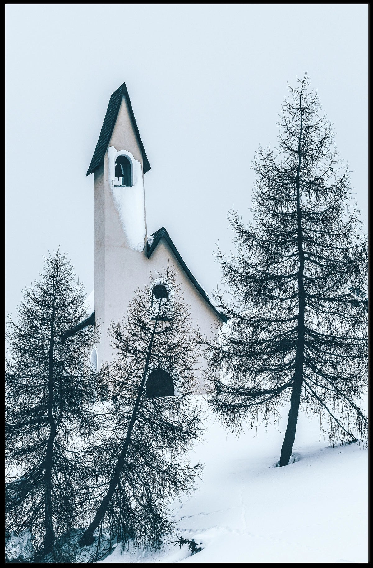 Serene Winter Chapel in Snowy Alpine Landscape