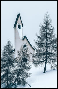 Serene Winter Chapel in Snowy Alpine Landscape