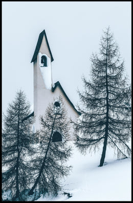 Serene Winter Chapel in Snowy Alpine Landscape