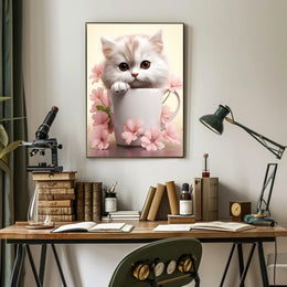 Kitten In A Cup Poster PosterGoat